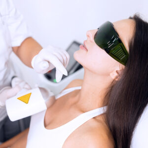 Laser hair removal for facial skin. Woman in epilation salon