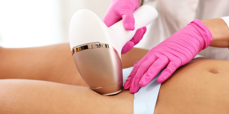 Picture of adult woman having laser hair removal in professional aesthetic clinic